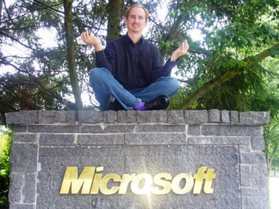 Colin having a Zen moment atop of Microsoft sign