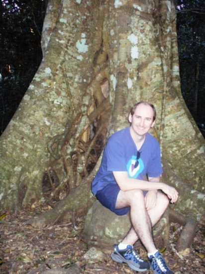 Colin sitting by a tree