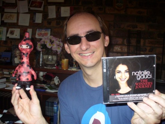 Colin with toy, Ray-ban's, and Australian Idol  CD