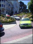 Someone taking a cab down Lombard Street