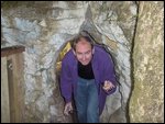 Colin emerging through a cave entrance