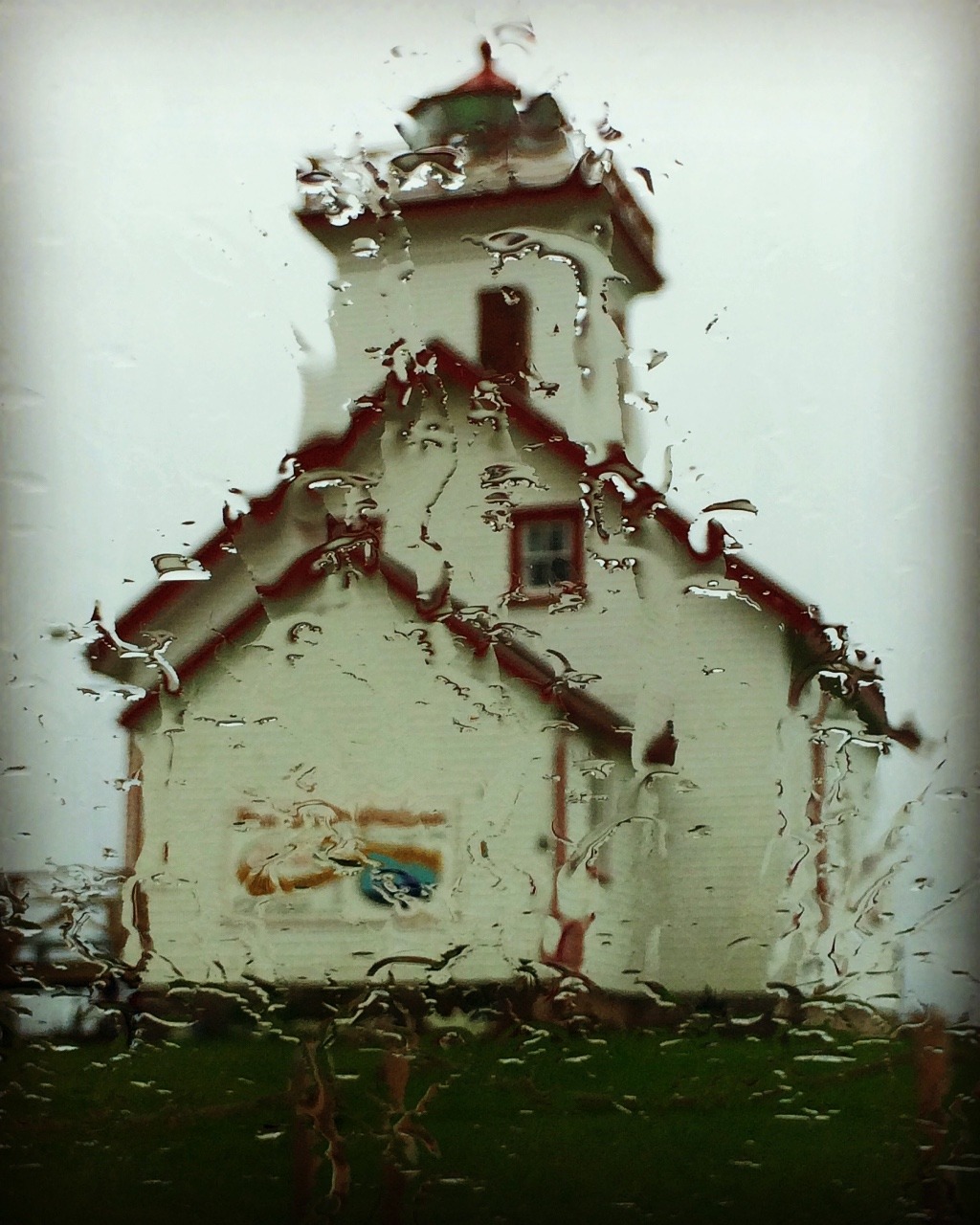 Wet lighthouse taken from our dry car.