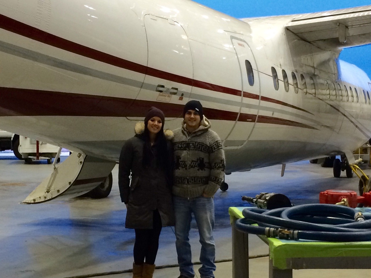 Paige and Mitch in front of the Dash 7