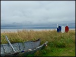 Broken Boat beside Acadian Flag